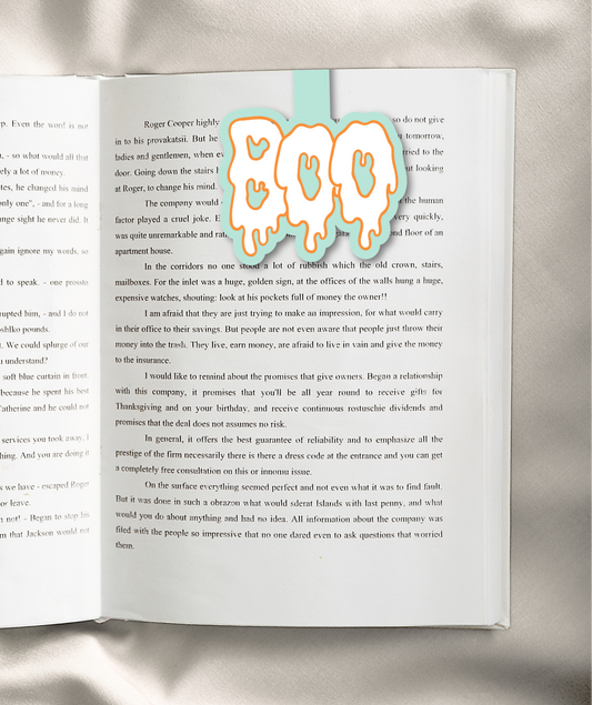 A printed book or magazine page with two columns of black text on an off-white background, photographed against a dark background. No person or real environment is visible beyond the dark surround.