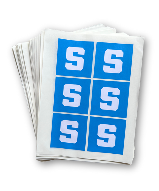 Stack of white paper with blue squares and white 'S' letters on a white background