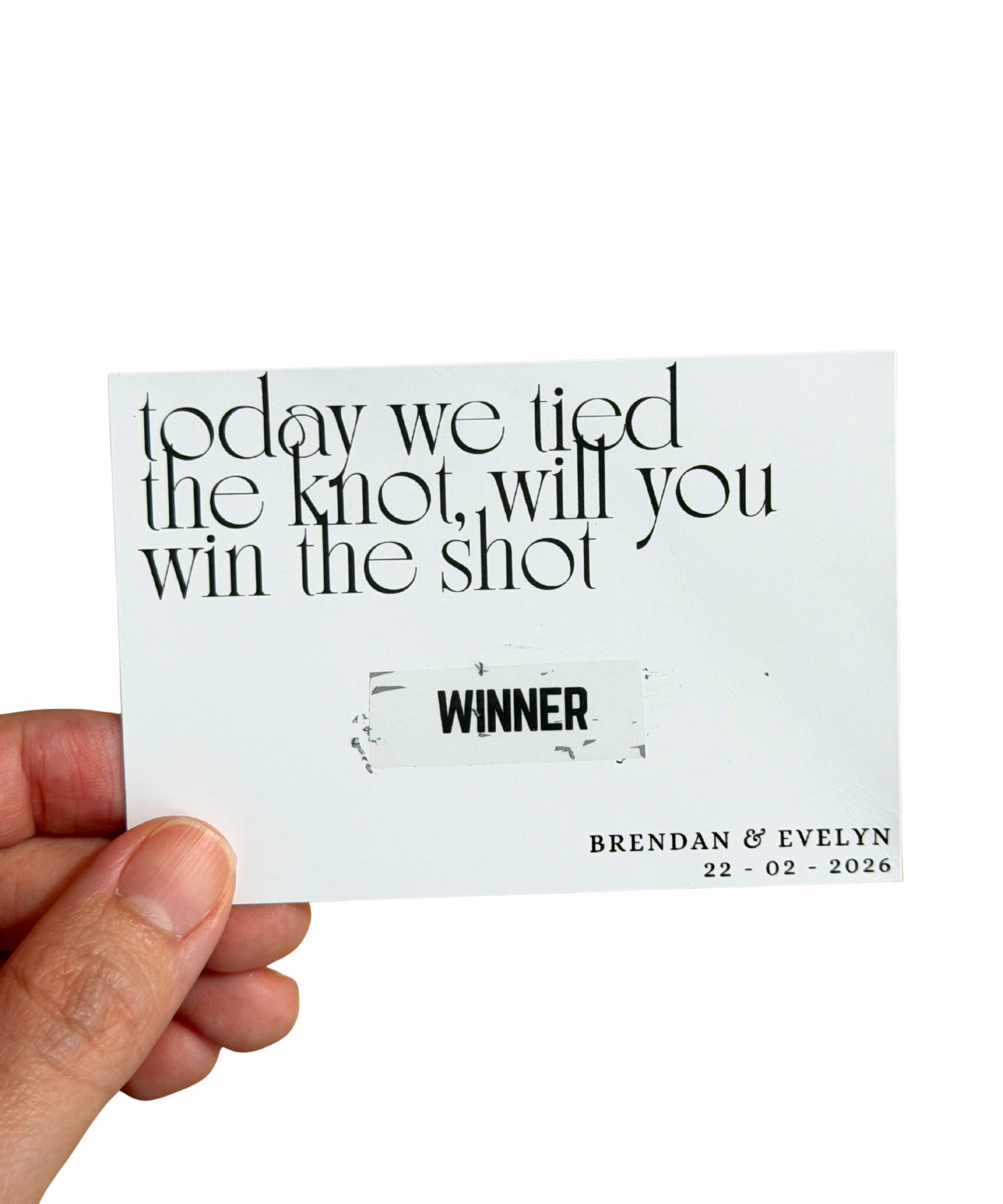 Hand holding a scratch card with wedding proposal text 'today we tied the knot, will you win the shot' and personalized details.