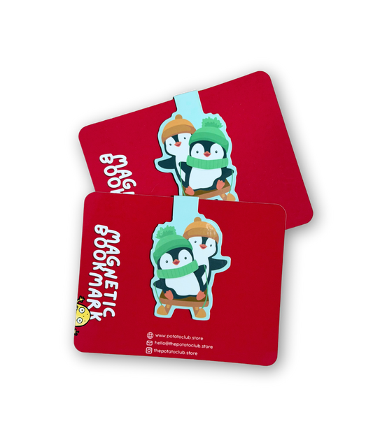 Two red bookmarks with cartoon penguins on a white background