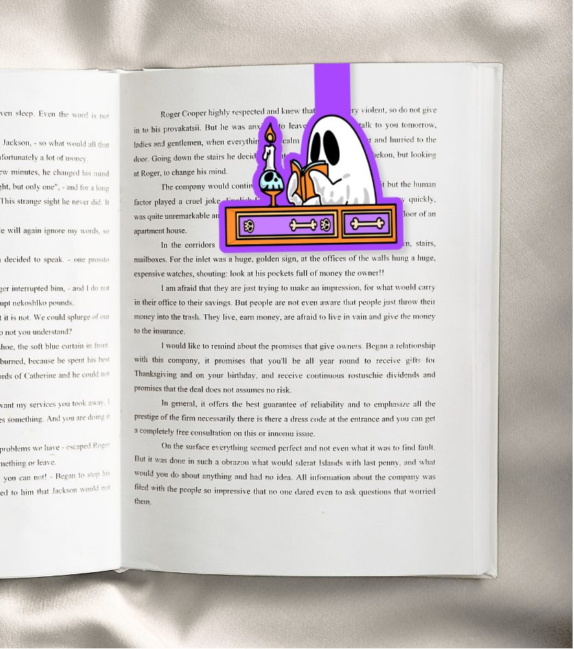 An open book with printed text spread across both pages, featuring a colorful cartoon illustration of a character in a purple hat and a gold sign on the right page, photographed against a neutral gray background.
